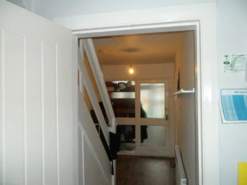 Before shot of the ugly, outdated hallway