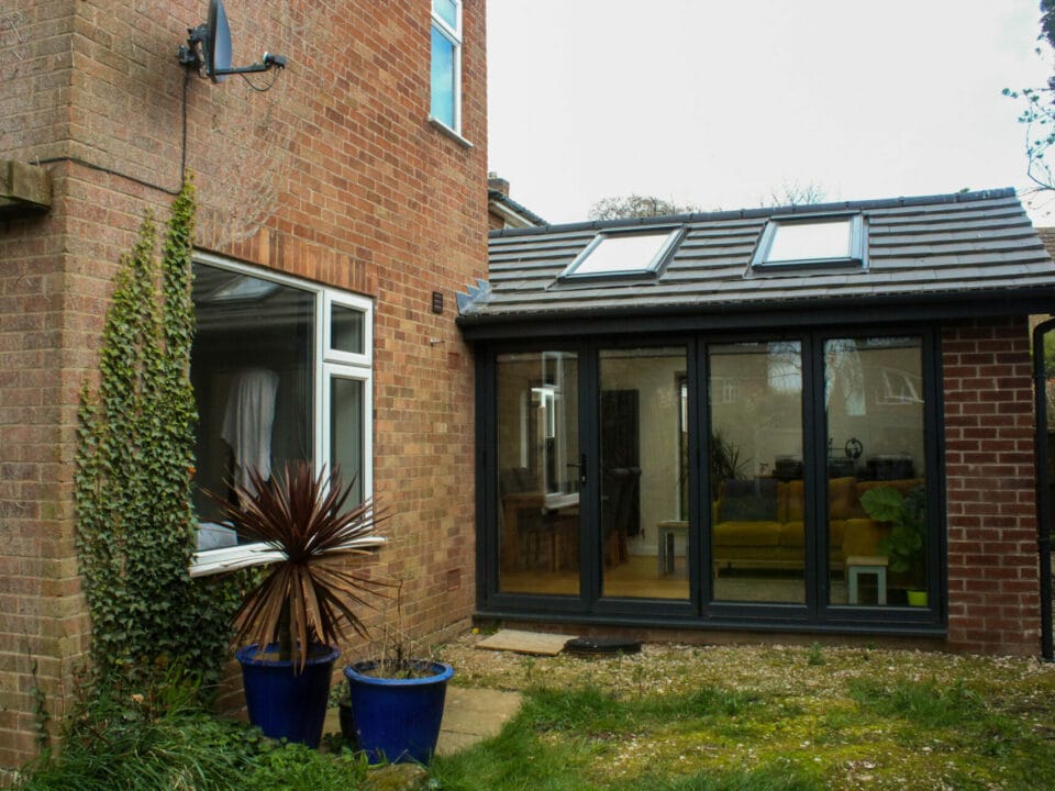 Completed extension with single storey, brick and bi-fold doors.